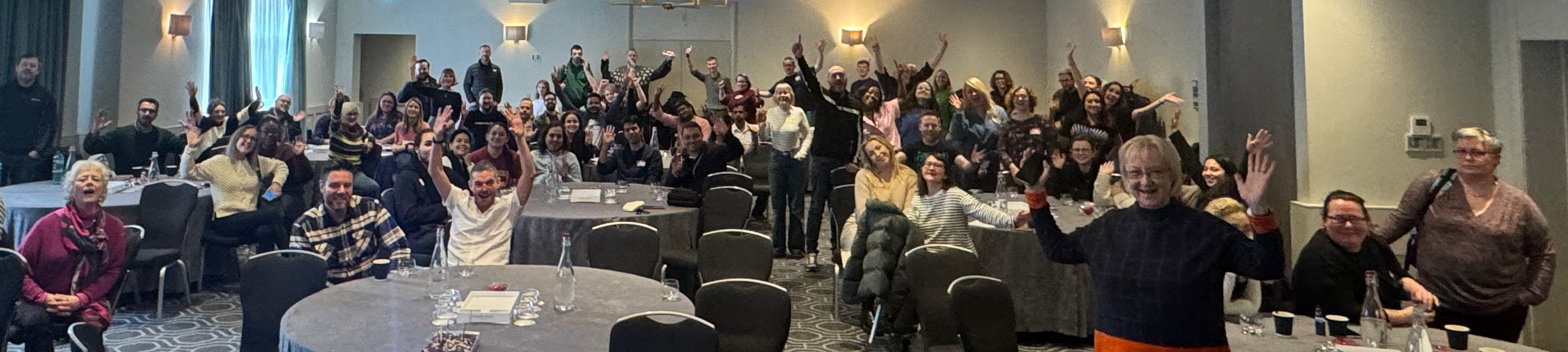 The Nexer Digital team all wave and smile at the camera