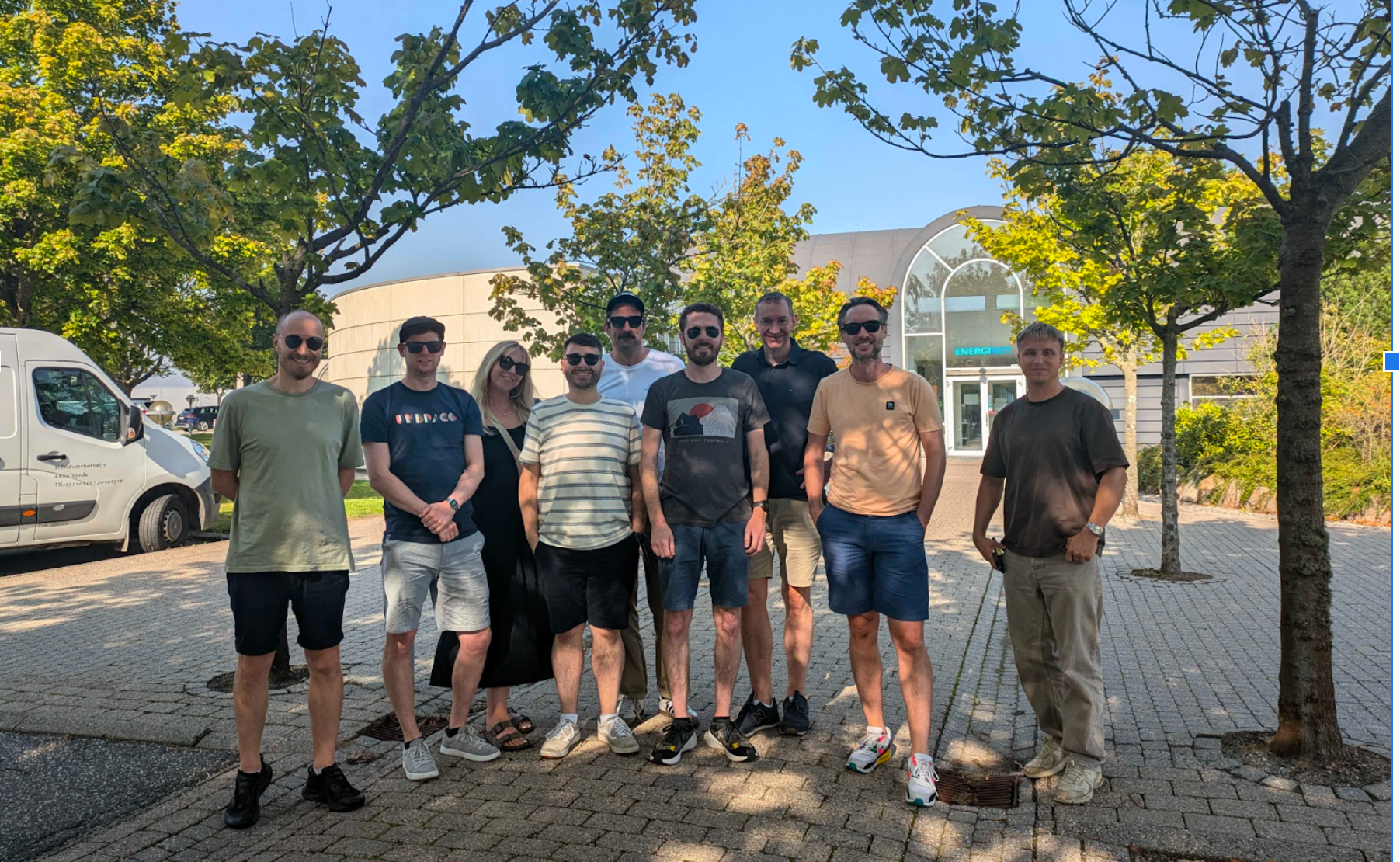 The Umbraco Sustainability Community Team stand in a group smiling