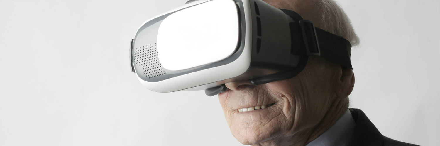 An image of an older person wearing a VR headset