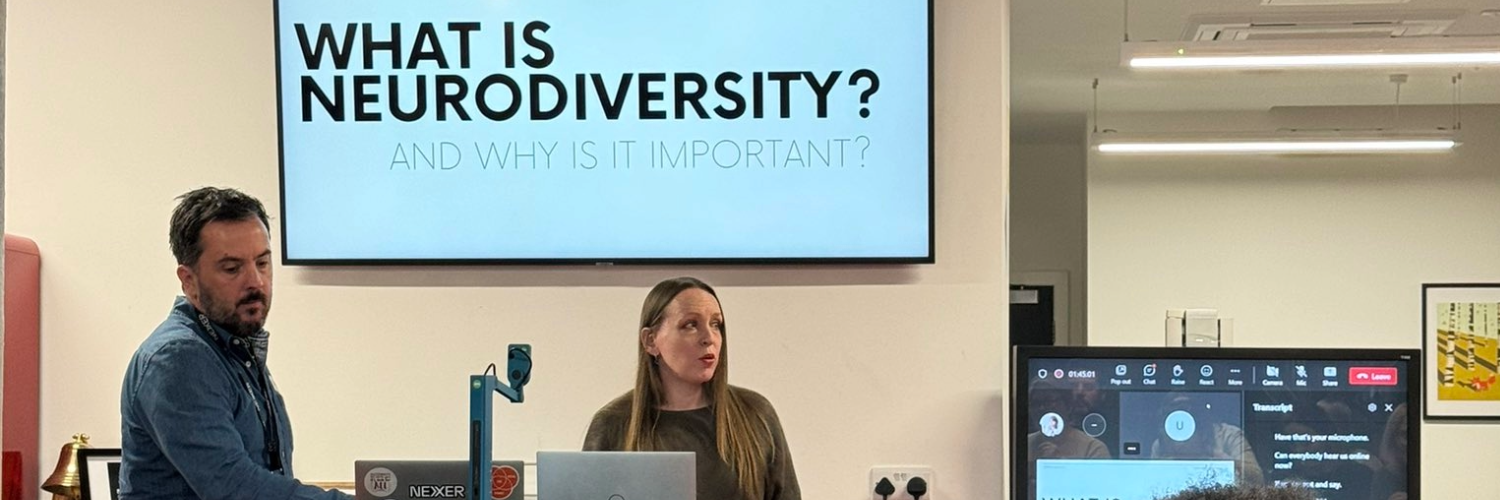 Neurodiversity consultant Rachel Morgan-Trimmer stands in the Nexer Digital office, presenting from a slide titled 'What is neurodiversity?'