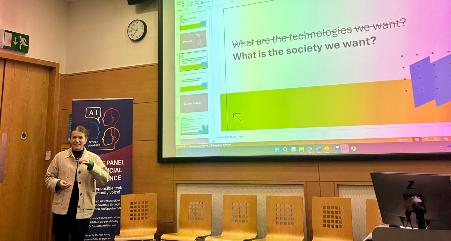 Manchester's Digital Strategy's Megan Lawless speaking in front of a slide reading "What are the technologies we want?" crossed out and replaced with "What is the society we want?"