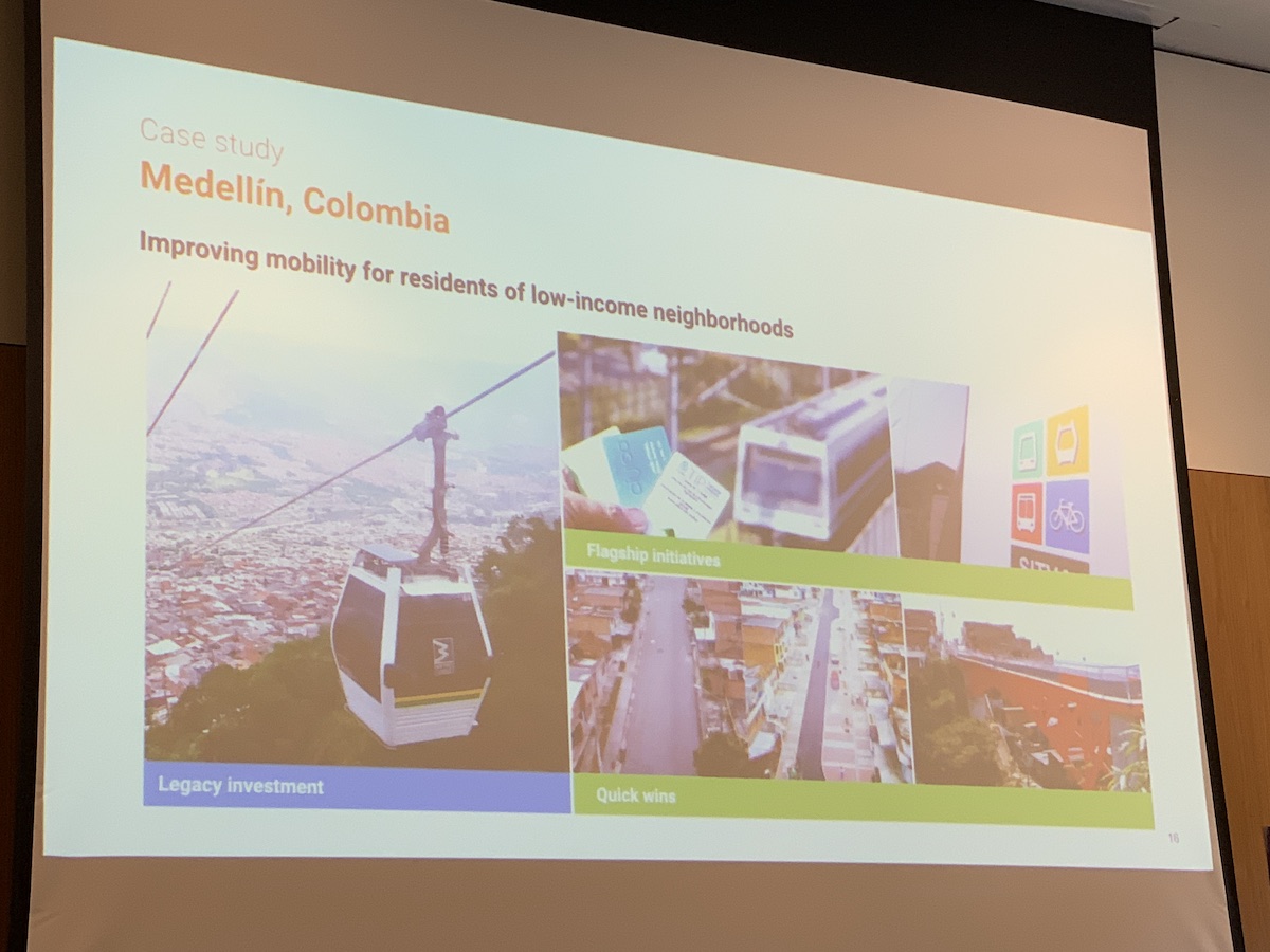 A slide titled 'Case study: Medellin, Columbia. Improving mobility for residents of low-income neighbourhoods. Underneath three images are the words 'Legacy investment', 'Flagship initiatives', 'Quick wins'. 