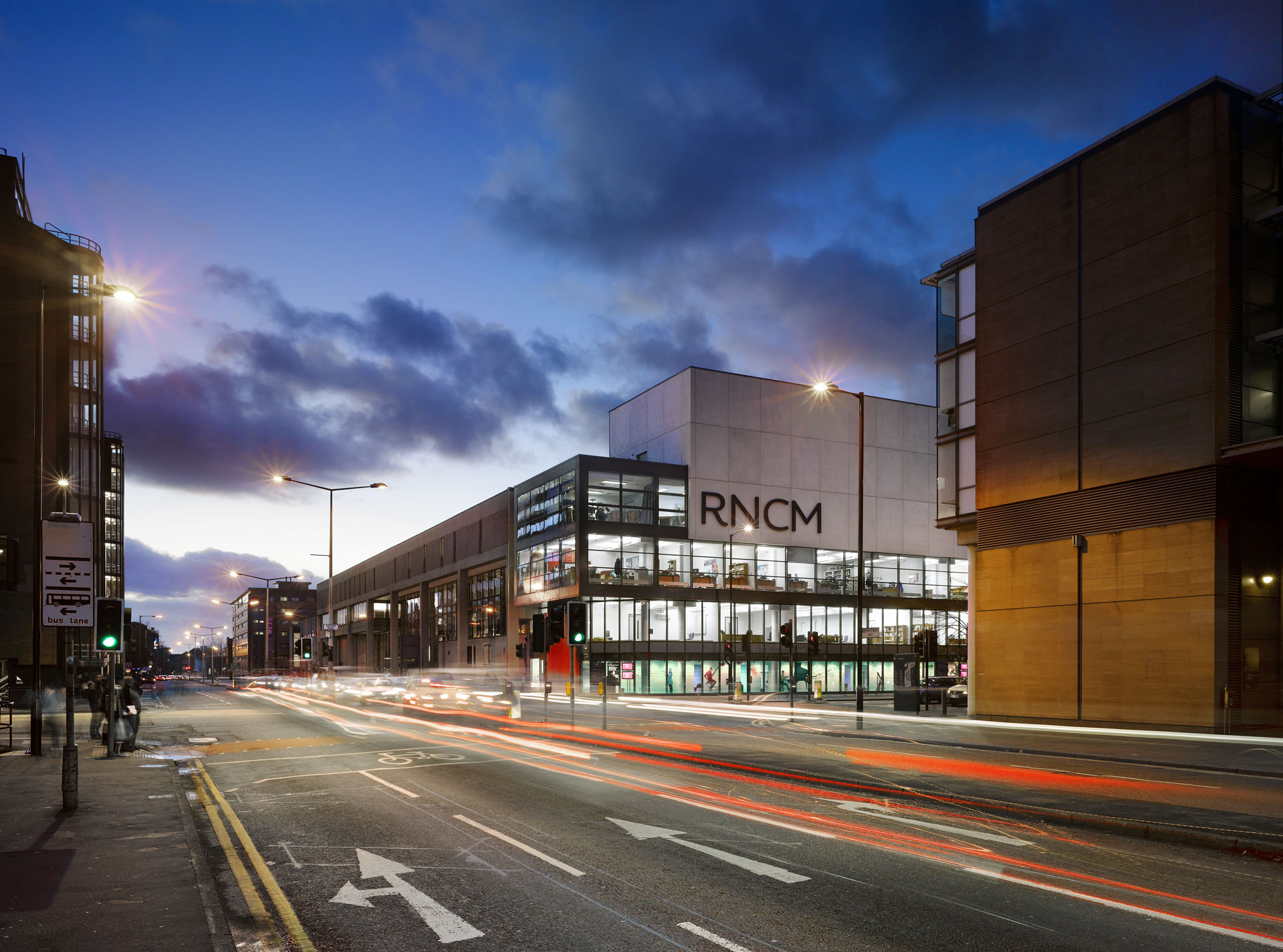 The Royal Northern College of Music building with lights from cars going down the street